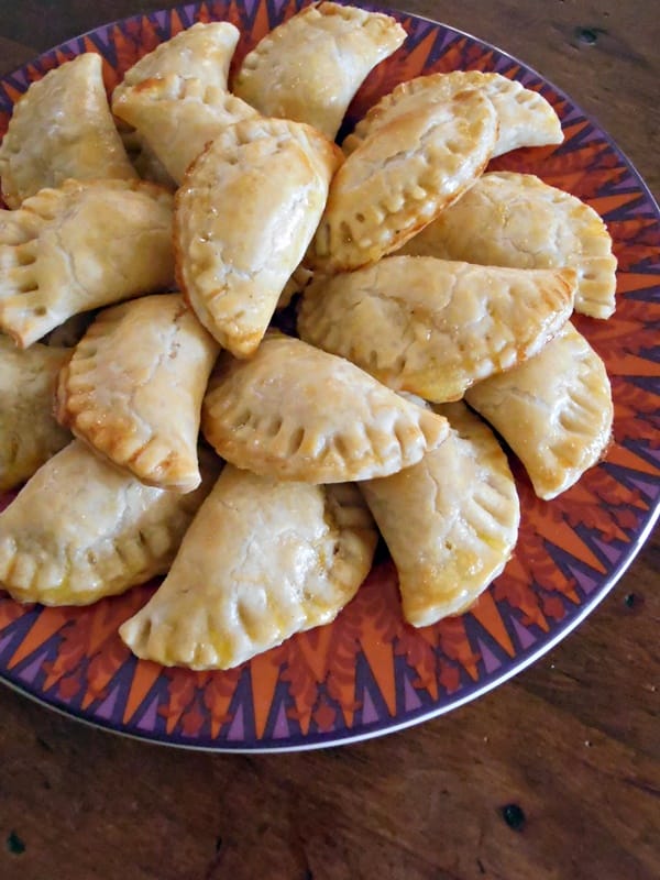 Plate of Shortcut Chicken and Green Chilies Empanadas, baked and lightly golden brown.