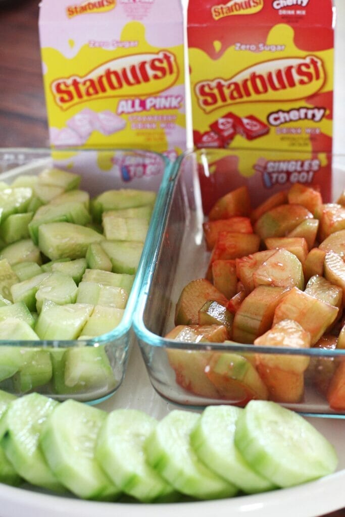 Prepared Sugar-Free Tiktok Starburst cucumbers, flavored strawberry and cherry, in glass storage dishes.