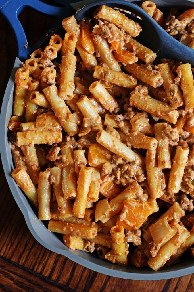 Creamy Taco Hamburger Helper - A delicious and easy meal that's perfect for busy weeknight dinners! This recipe features ziti noodles tossed with seasoned ground beef, creamy salsa-infused sauce, and melted cheese.